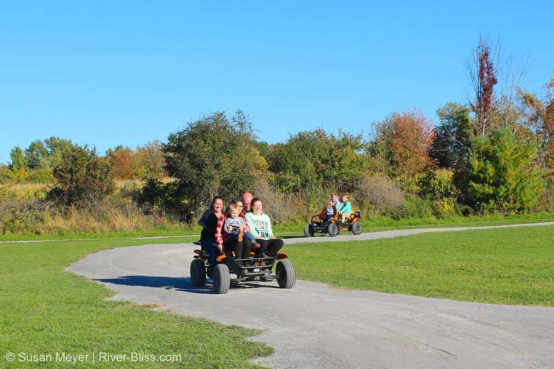 families riding on pedal carts