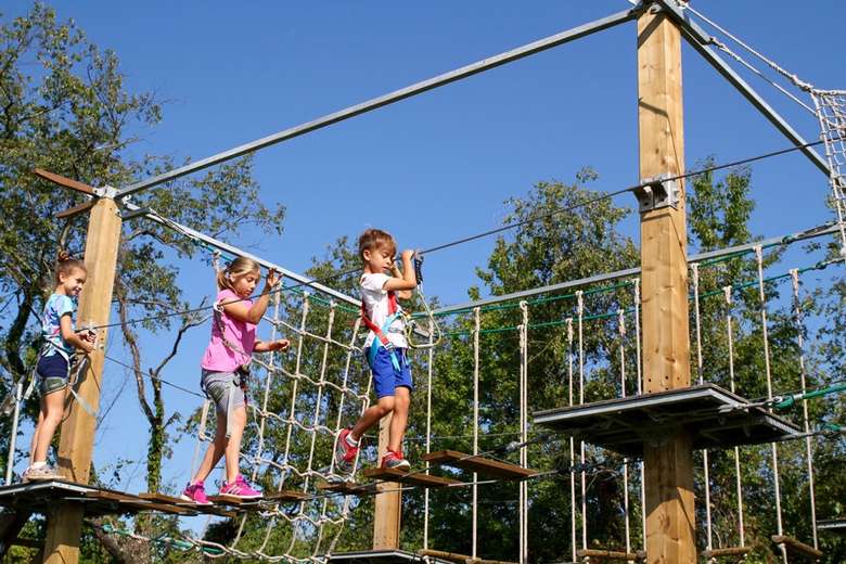 kids doing a ropes course